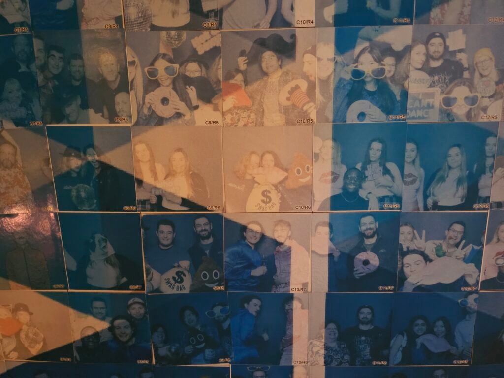 A collage of blue-tinted photo booth snapshots features groups posing with props, fancy dress, and sunglasses, all smiling and having fun against festive backdrops—perfect inspiration for premium photo booth hire or unforgettable corporate event experiential moments.